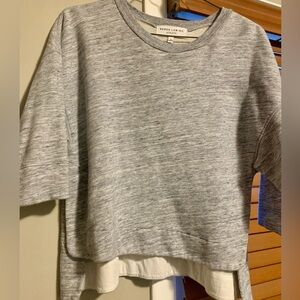 Derek Lam IOC for Athleta. Gray sweater with buttons.